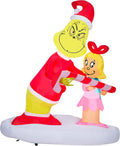 Gemmy Airblown Inflatable Grinch Passing Out Candy Canes to Cindy Lou Scene Dr. Seuss, 5.5 ft Tall
