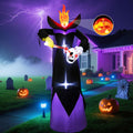 Tall inflatable headless reaper holding a skull under a stormy sky