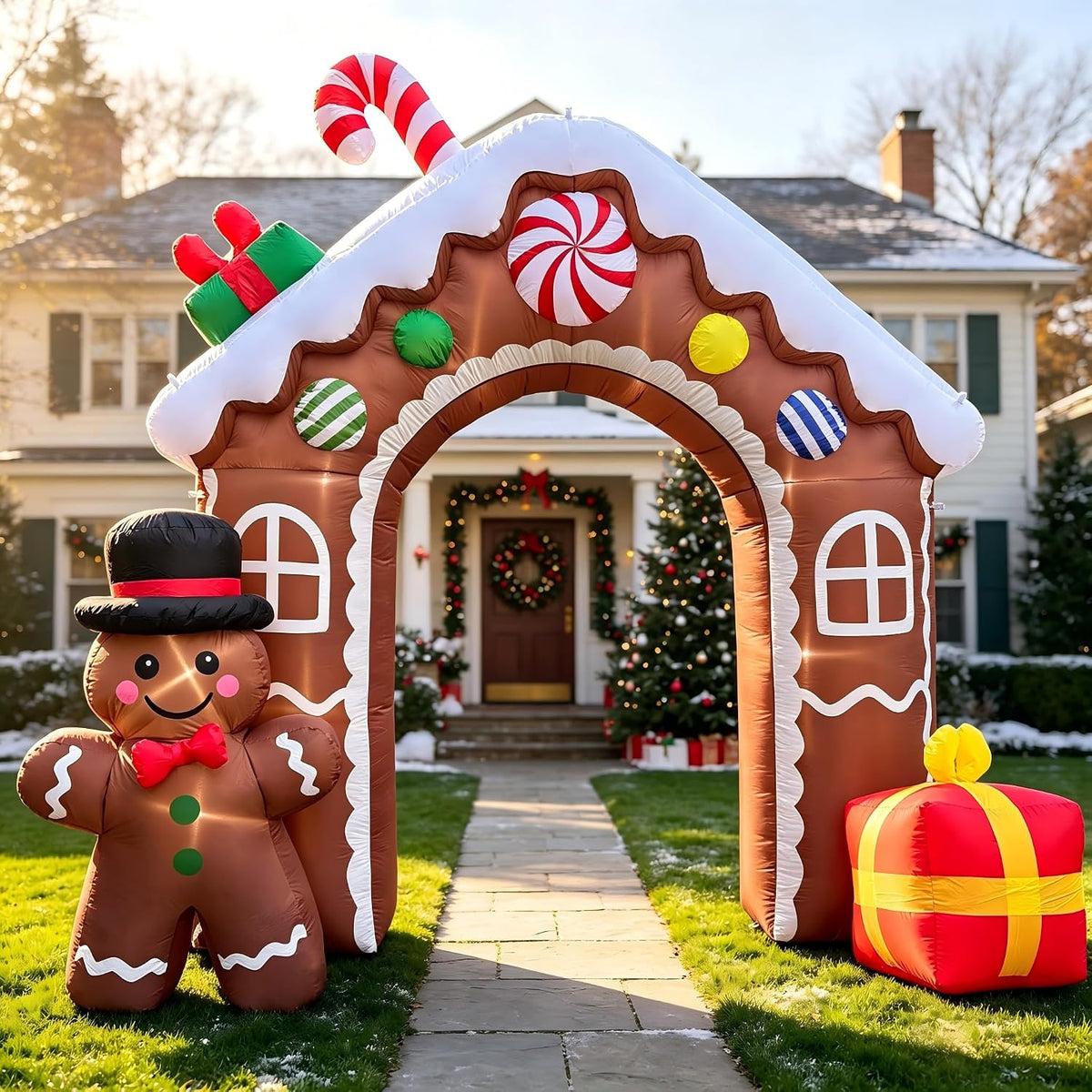 Inflatable gingerbread cookie house arch with a gingerbread man and gifts